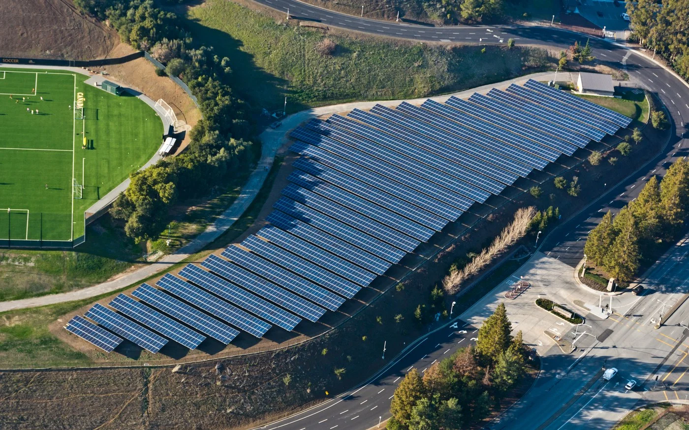 Aerial view of the Cañada College hillside ground-mount solar array above the campus