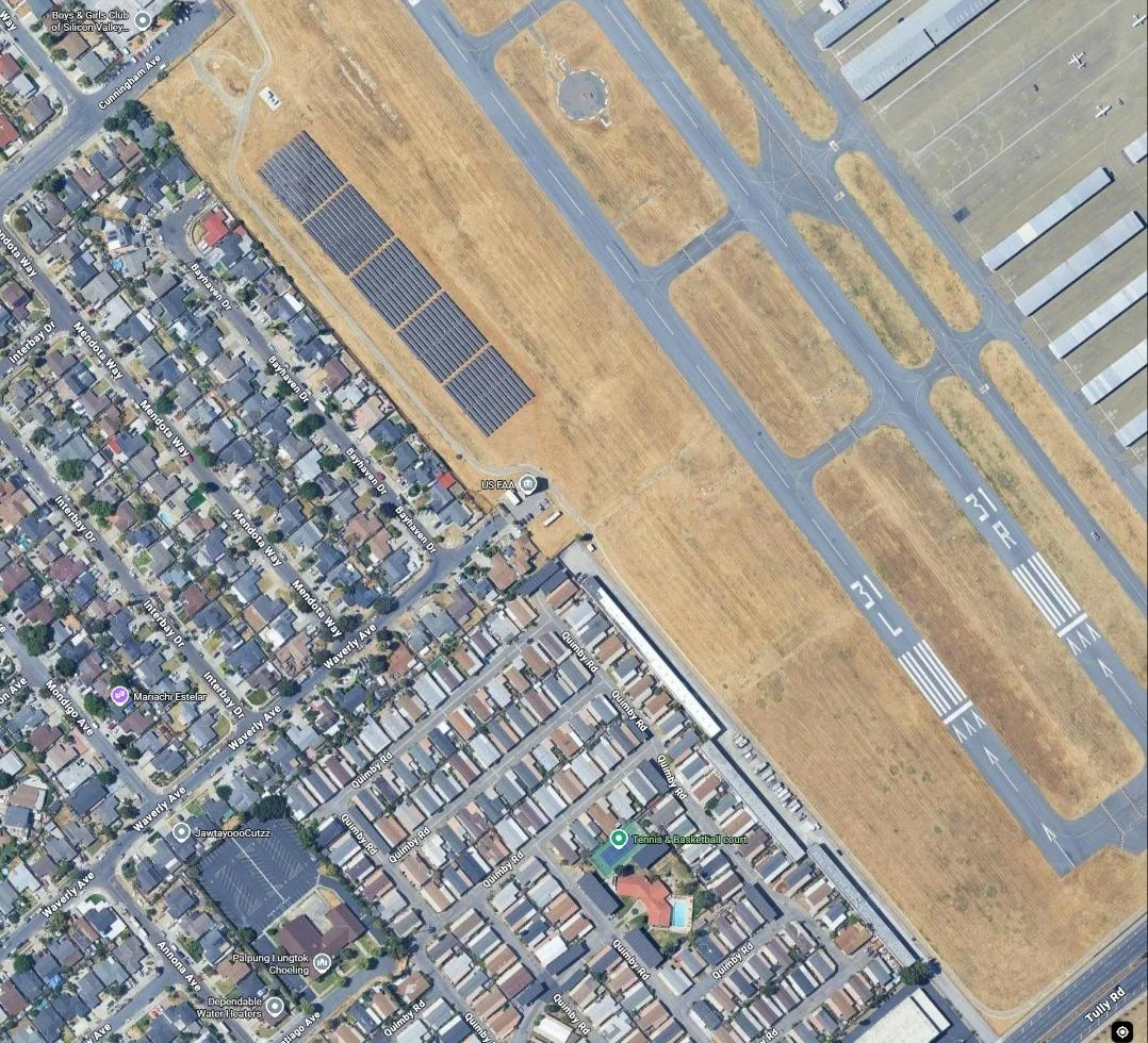 Satellite view of the helix-tracker solar array along the Reid-Hillview Airport runway, adjacent neighborhood in foreground